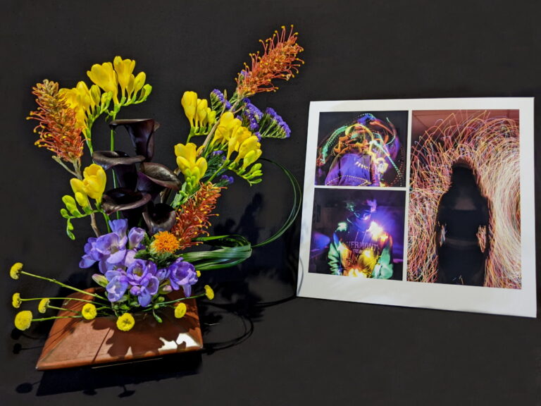 Shlawna Sikochi’s floral arrangement mimics digital photography light paintings by several Bromfield photographers as seen in last year’s Bloom N Art show.